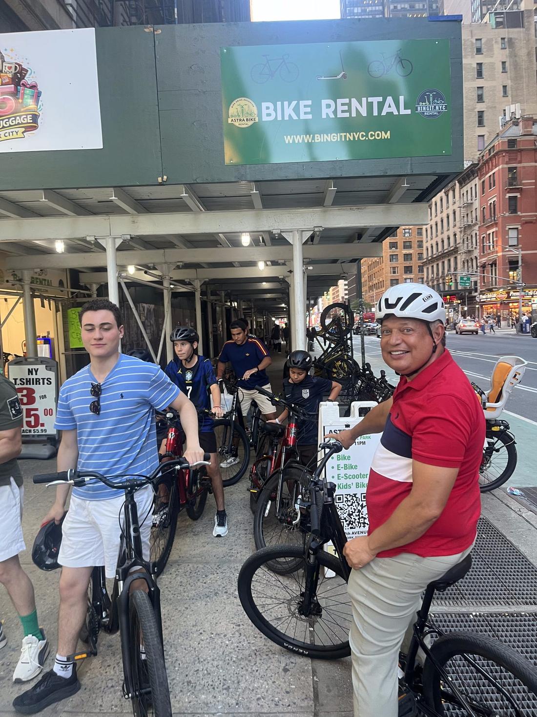 Astra Bike customers getting fitted with bikes outside the Central Park shop